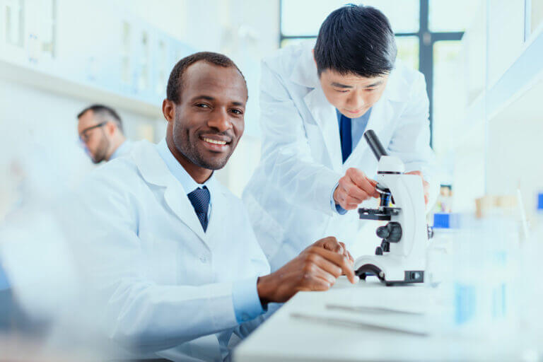 Young Doctors In Uniform Working At Testing Laboratory, Laboratory Technicians