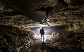 Silhouette,Of,A,Cave,Explorer,In,The,Underground