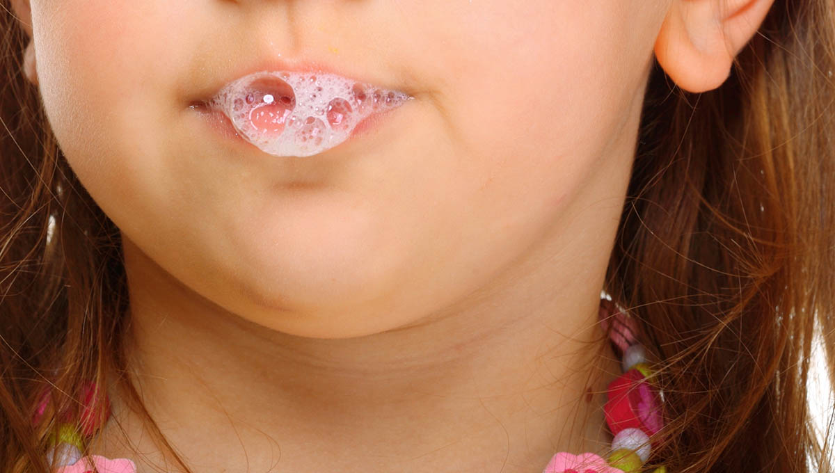 Close,Up,Part,Of,Face,Little,Girl,Doing,Fun,Saliva