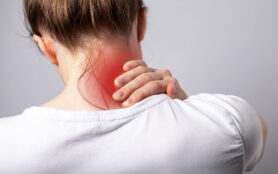 Woman,Suffering,From,Neck,Pain.,Head,Back,With,Red,Spot