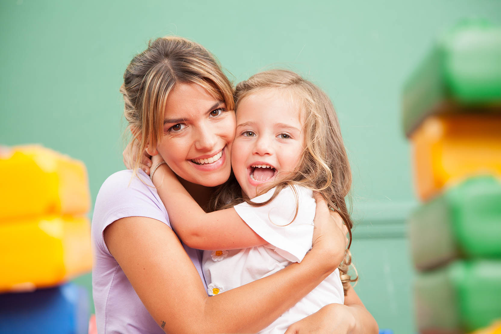 Girl,And,Teacher,Playing,In,Kindergarten