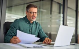 Smiling,Middle,Aged,Executive,,Mature,Male,Hr,Manager,Holding,Documents