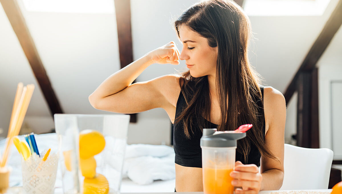 Woman,At,Home,Drinking,Orange,Flavored,Amino,Acid,Vitamin,Powder.keto